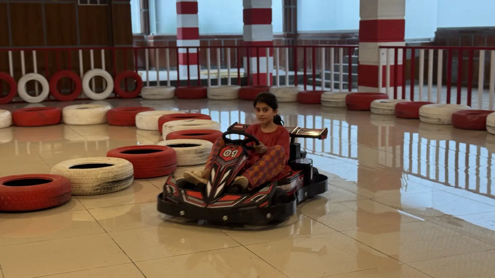 Child racing a go-kart at Funzania