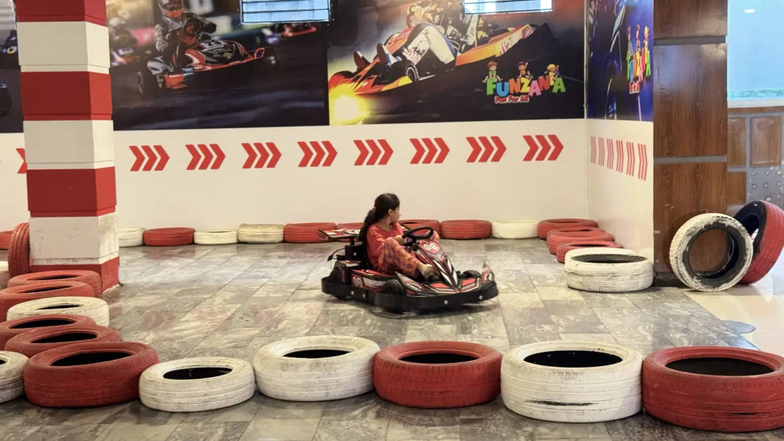 Girl driving a go-kart at Funzania