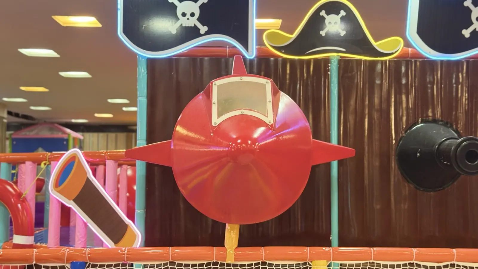 Pirate-themed wall art near the go-kart track