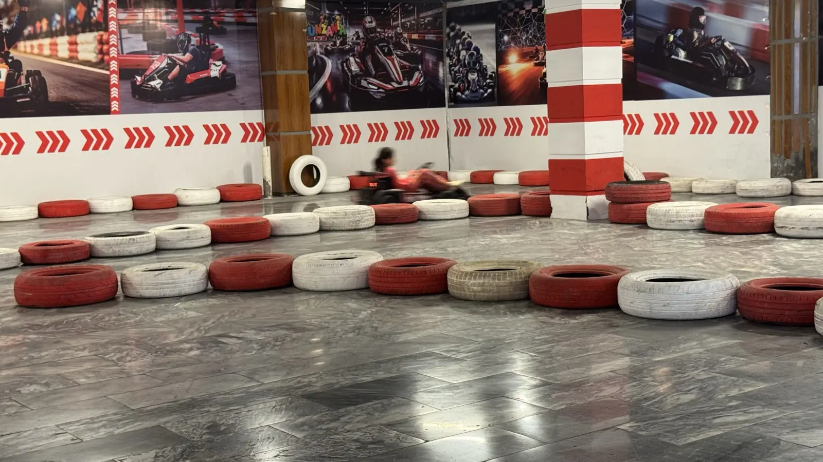 Indoor go-kart track lined with tyres