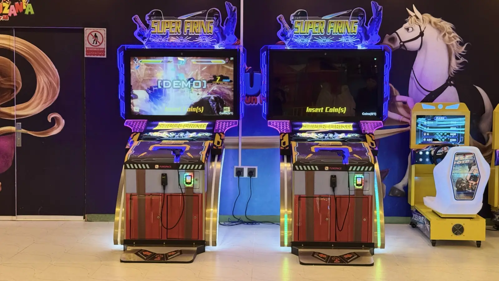 Row of racing simulator cabinets at Funzania