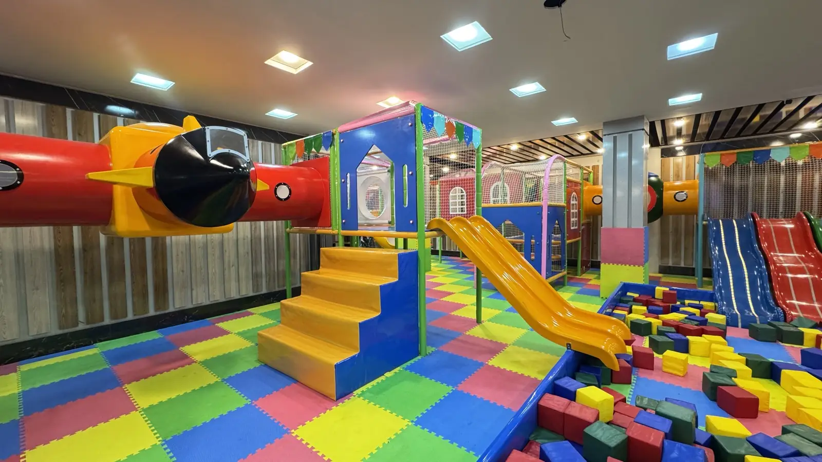 Soft play climbing stairs and slide at Funzania